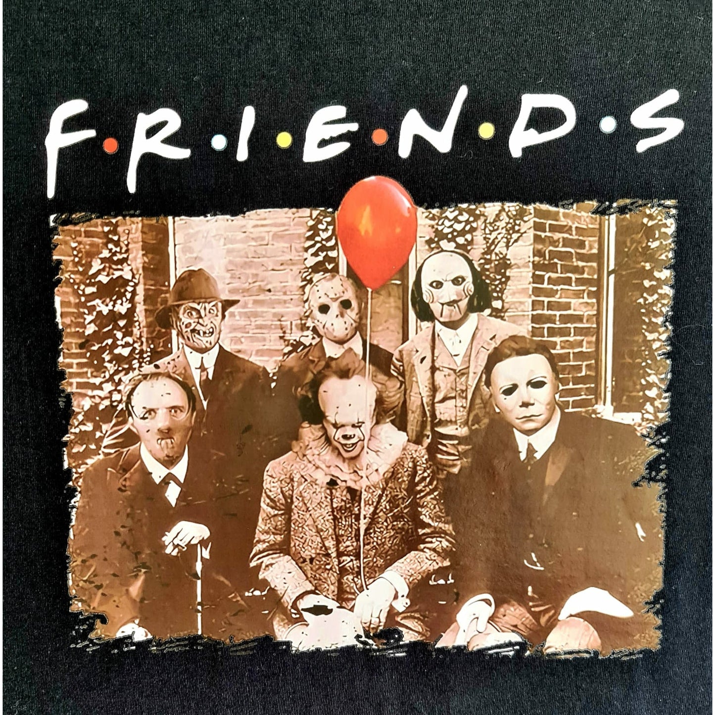 Black t-shirt featuring a horror-themed mashup of the "Friends" TV show with a group photo and a red balloon