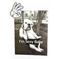 White t-shirt featuring a black and white graphic of a bulldog sitting on a swing with the text "I'm Sexy Baby" and a hand making an "OK" gesture above